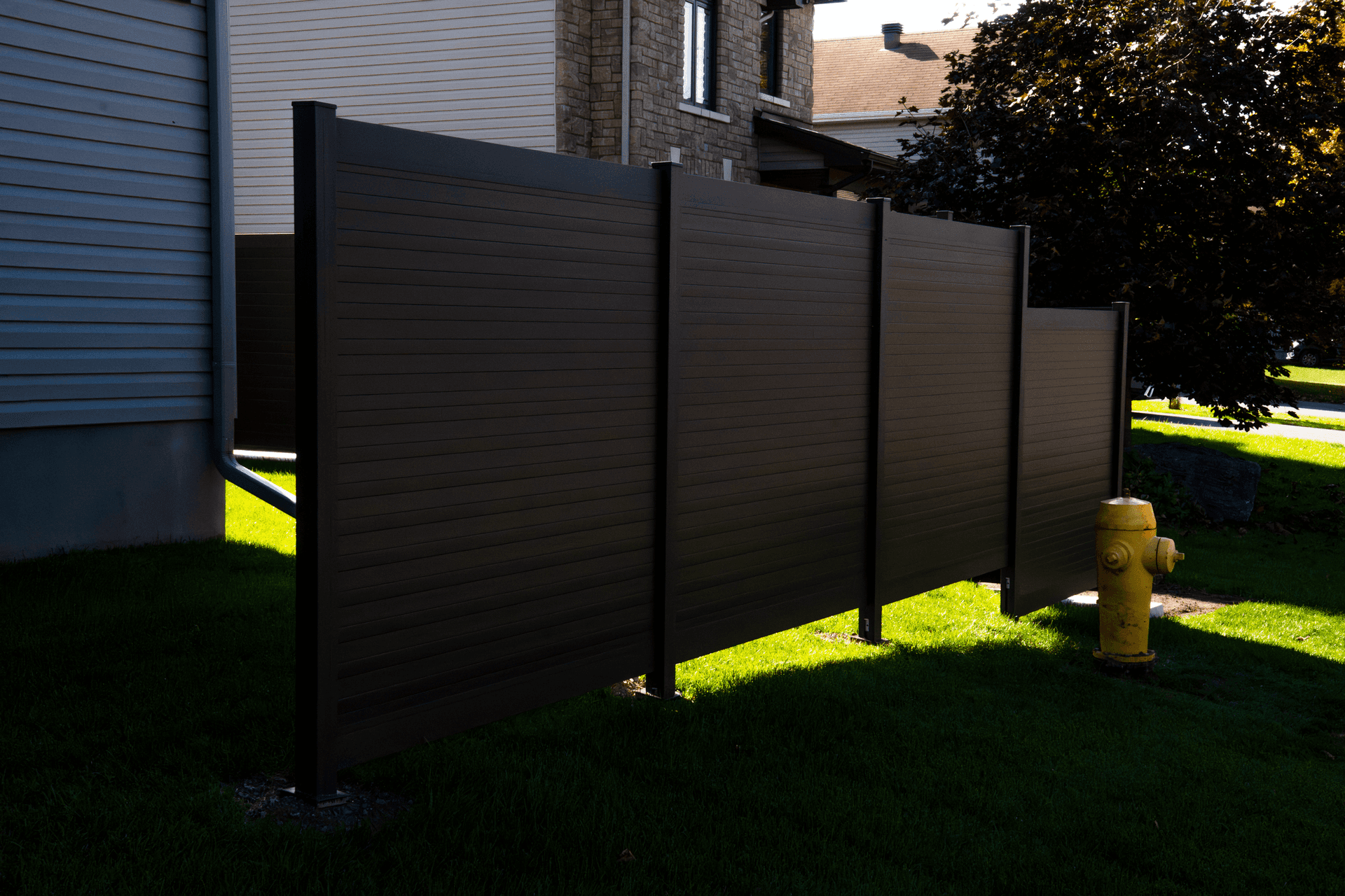 Detailed view of horizontal aluminum fence panel construction showing slat profile and post connection