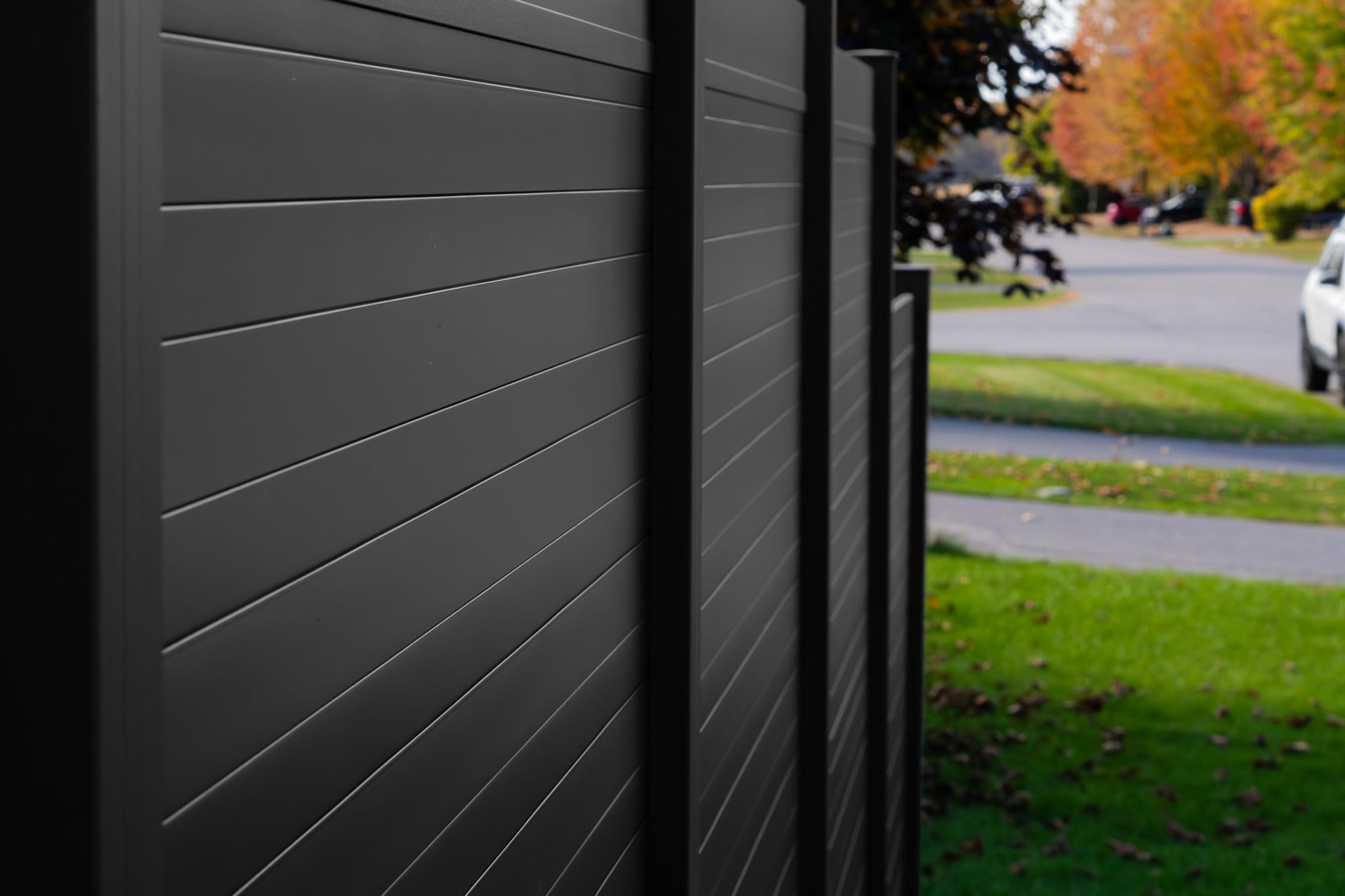 Professional aluminum privacy fence installation on a residential property in Canada